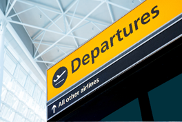Image of a depatures sign at the airport